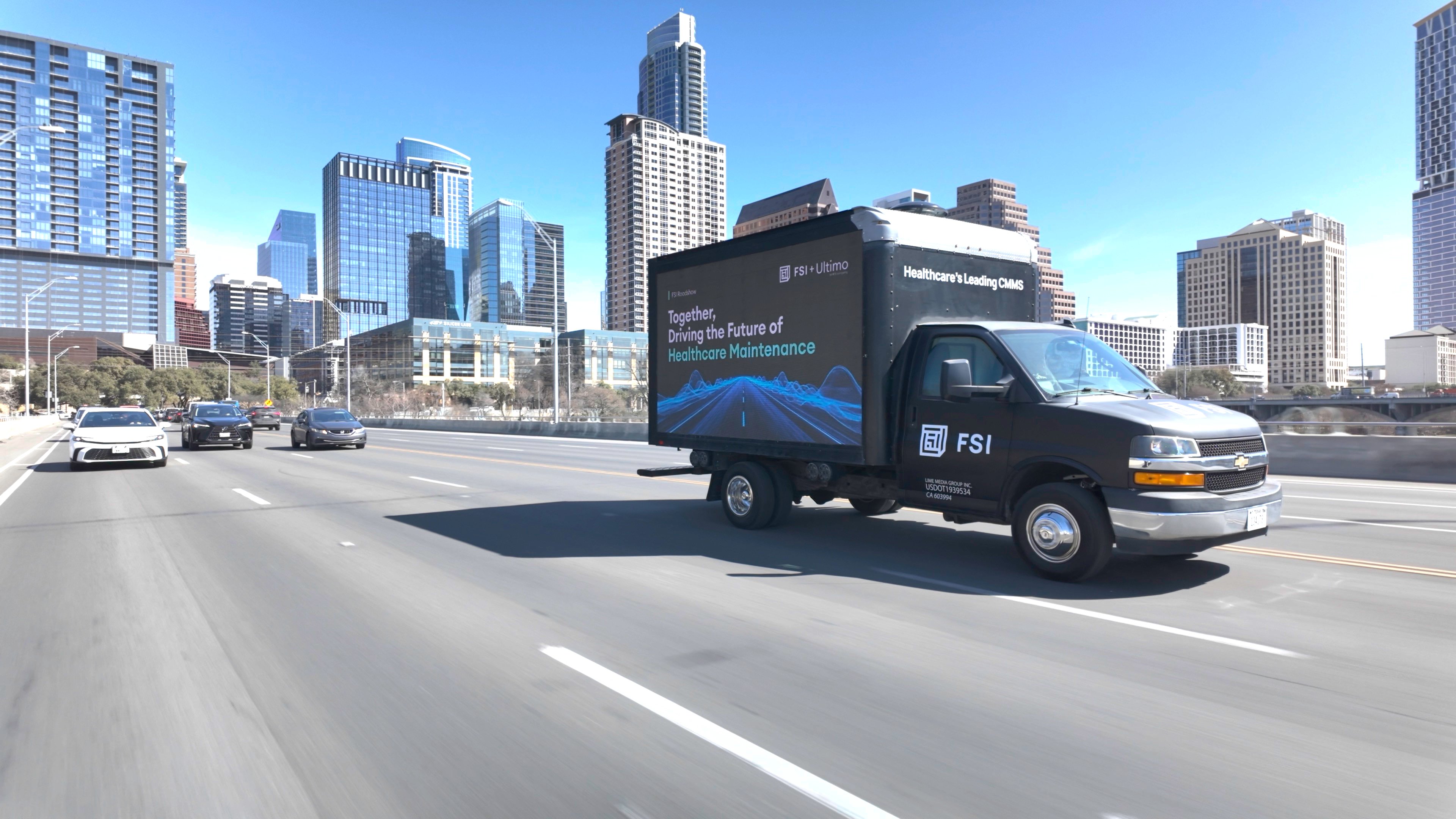 Truck driving Austin cityscape